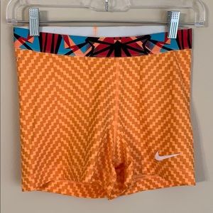 Nike pros. Orange booty shorts